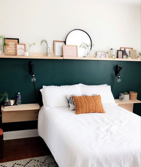 Art Shelf Above Bed, Dark Green Half Wall Bedroom, Picture Rail Above Bed, Wall To Wall Shelf Above Bed, Long Shelf Over Bed, White Bedroom With Colorful Accents, Bedroom With Ledge Wall, Box Shelves Bedroom, Bedroom Picture Shelf