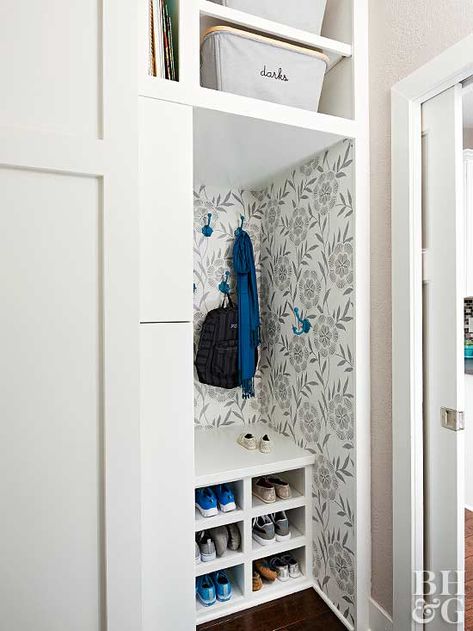 In a small space such as an entryway, vertical storage is key. This doorless closet-turned-cubby uses a storage shelf to keep shoes out of the way. #entryways #frontentryway #openentryway #diyentryway #bhg Update Coat Closet, Small Coat Cupboard Ideas, Coat Closet To Mudroom Diy, Front Closet Cubbies, Doorless Coat Closet, Small Entryway Closet Organization, Wallpaper Coat Closet, Coat Closet Wallpaper, Small Mudroom Closet