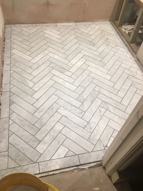 Carrera marble herringbone with manhattan grey grout #kerryvilla #tottenham #renovation Herringbone Floor Bathroom, Herringbone Bathroom Floor, Marble Herringbone Floor, Herringbone Tile Bathroom, Herringbone Tile Floors, Marble Bathroom Floor, Marble Herringbone, Grey Grout, Carrera Marble