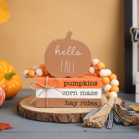 PRICES MAY VARY. 🎃Fall Wood Book Stack: This lovely fall décor set includes brown pumpkin, 3 mini faux wood books and a wood bead garland which are a perfect addition to your thanksgiving decor 🎃Size: The books stacked is 5.5*3.5*2.4 in, the pumpkin sigh is 3.9*3.9*0.6 in, the length of the bead garland is 29in, the wooden book is printed with "sweater" and "weather", and the pumpkin is printed with "hello fall", which is full of autumn atmosphere. 🎃High-quality: The fall pumpkin ornament and Wooden Tray Decor, Books Stacked, Decor For Table, Autumn Farmhouse, Block Signs, Fall Tiered Tray Decor, Thanksgiving Kitchen, Wooden Pumpkins, Pumpkin Sign