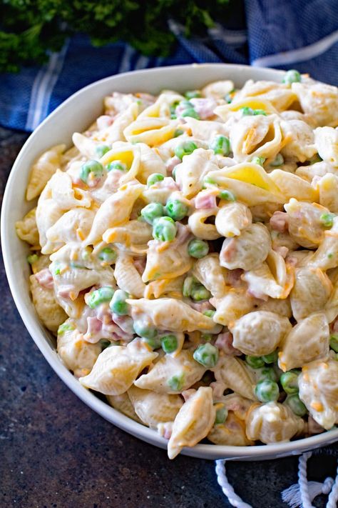 A Classic Macaroni Salad that is a hit at all my parties and BBQs with both kids and adults. It's quick, easy and delicious which makes it the perfect side dish. Make it for summer parties, 4th of July or a potluck! #macaroni #salad #macaronisalad #pastasalad #pasta #recipe #recipeinspiration #recipeidea #julieseatsandtreats Shell Macaroni Salad, Cold Pasta Recipes, Snacky Foods, Salad Macaroni, Classic Macaroni Salad, Seven Layer Salad, Cold Pasta Salad Recipes, Easy Pasta Salad Recipe, Macaroni Salad Recipe