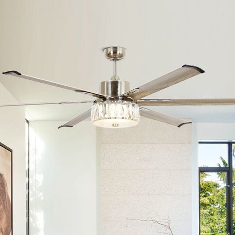 This 65" integrated LED brushed nickel ceiling fan decorated with six wood grain finish aluminum blades is great for large areas or lofts. This ceiling fan features a glam display of crystals to create an elegant, glamorous accent in your room. The 6-speed reversible DC motor housing enables it to not only cool during the summer but helps circulate warm air during the winter. For added ease and elevated luxury, the features and fan functions are adjustable by remote control. Ceiling Fan Bedroom Master Suite, Bedroom Fans With Lights, Bedroom Ceiling Fans With Light, Glam Ceiling Fan, Ceiling Fan Ideas, Bedroom Ceiling Fans, Elegant Ceiling Fan, Living Room Ceiling Lights, Lightning Ideas