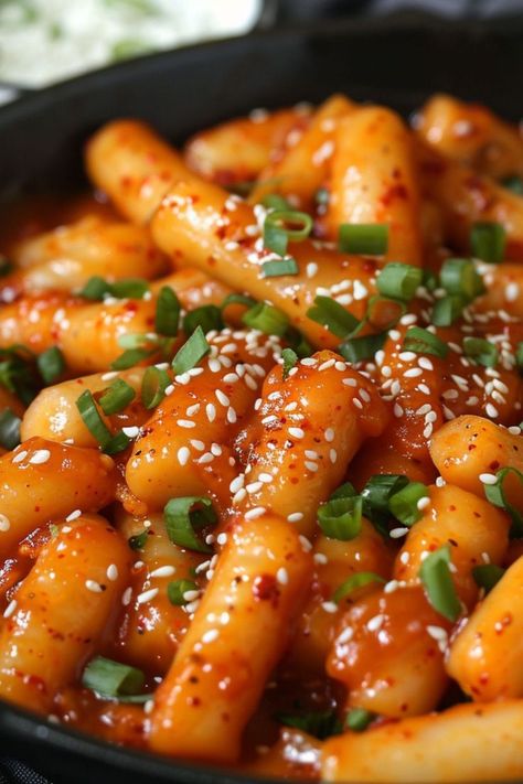 Korean Spicy Rice Cakes (Tteokbokki) are a delicious and nutritious choice for any mealtime! 🍲🌶️ Made with chewy rice cakes and spicy gochujang sauce, this dish is a delightful blend of bold flavors and satisfying texture. Quick to prepare and bursting with savory goodness, Korean Spicy Rice Cakes are perfect for a refreshing lunch or special treat. Indulge in this vibrant twist on a classic favorite today! 😋🌿 #Tteokbokki #KoreanCuisine #HealthyEating #SpicyFlavors Yummy Food Spicy, Korean Rice Cake Tteokbokki, Tobboki Korean, Korean Spicy Food, Rice Cakes Korean, Tteokbokki Aesthetic, Food With Rice, Korean Spicy Rice Cake, Spicy Tteokbokki