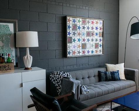 22 Fun and Cheap Ideas for DIY Cinder Block Projects Decorating Cinder Block Walls, Industrial Decor Living Room, Concrete Block Walls, Cinder Block Walls, Black Accent Walls, Grey Couch Living Room, Basement Makeover, Industrial Livingroom, Basement Walls