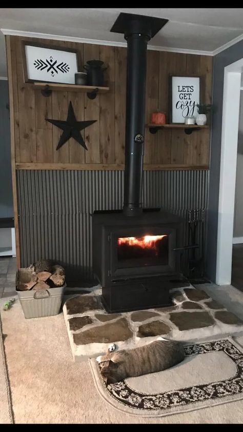 Wood Stove In Garage, Tin Home Decor, Tin And Wood Walls Living Room, Tin Behind Wood Stove, Wood Stove Tile Surround, Pellet Stove Hearth Ideas, Wood Stove Living Room Layout, Corner Pellet Stove Ideas, Wood Stove Mantle