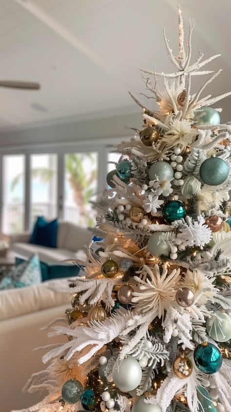 12 Stunning Christmas tree Themes {2024} - House On Austin Aqua Blue Christmas Tree, Aqua Christmas Tree Decor, Coastal Christmas Tree Ideas, Christmas Tree Turquoise, Aqua Christmas Tree, Themed Christmas Trees, Turquoise Christmas Tree, Christmas Trees Decorated, Beach Christmas Trees