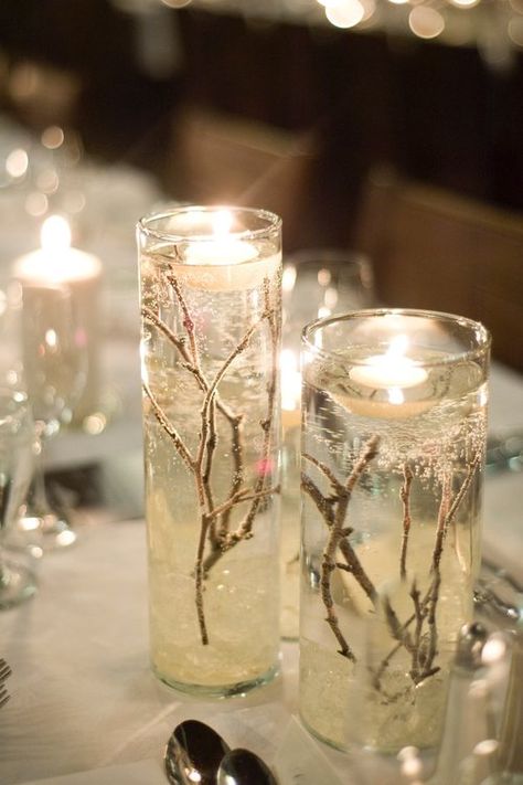 I designed my winter wedding around the idea of snow filled forest, using natural pieces like twigs, bark, and fire to make it warm and cozy. The guests all commented on the warm and classic feel and the not-overly-obvious theme. My colours were champagne, navy and ivory. I am selling the majority of my decor; please see a list below:  Extra Large Vases (shown with flowers), including "ice rock" and twigs, tulle optional: x8 [Diameter 6 ¼ ", Height: 26 ¾ "]  $30.00 each or $225 for 8 // ... Ice Party, Wedding Forest, Snow Wedding, Snow Theme, Deco Table Noel, Gel Candles, Prom Theme, Winter Wonderland Wedding, Forest Wedding