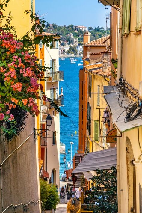 Narrow streets and historic houses of old town with Rue de lEglise street in Villefranche-sur-Mer resort town in France Antibes France Old Town, Old Town Aesthetic, France Streets, Nice Old Town, France Street, Antibes France, Villefranche Sur Mer, Italian Street, Historic Houses