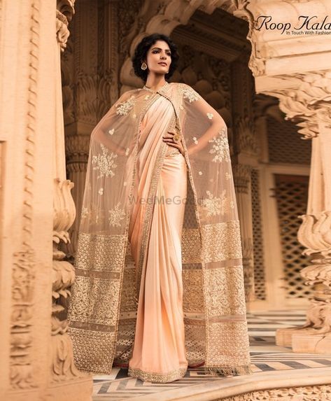 Elegant beige thread work cape with gold saree perfect for a pre-wedding function | WedMeGood|#wedmegood #indianweddings #capes #saree #pasteloutfit #pastelsaree #capejacket Saree With Cape, Cocktail Sarees, Fusion Saree, Sari Designs, Modern Sarees, Boutique Cafe, Saree Pattern, Gold Saree, Bride Reception Dresses