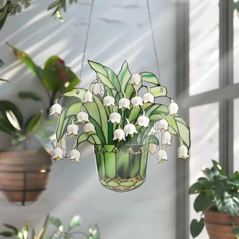 PRICES MAY VARY. Eye-catching design: Lily of valley suncatcher is exquisitely crafted with vibrant colors and playful charm, creating a mini vacation for your eyes. Its captivating design adds a splash of charming vibes to your living space Versatile decoration: Whether you hang it indoors near a window or adorn a cozy corner, acrylic suncatcher brightens up any room on even the gloomiest day. It effortlessly adds a touch of elegance to your garden or enlivens a sunlit window, creating a serene atmosphere in your home or outdoors Symbol of peace and joy: These lily of valley suncatchers are more than just decorative items; they are symbols of peace and joy. As the wind dances with the subtle scent of lily of valley, they catch the attention of any admirer of your garden, bringing tranquil Lily Of Valley, Artistic Home Decor, Stained Glass Window Hangings, Flowers Acrylic, Crystal Suncatcher, Decor Flowers, Artistic Home, Stained Glass Suncatcher, Stained Glass Window