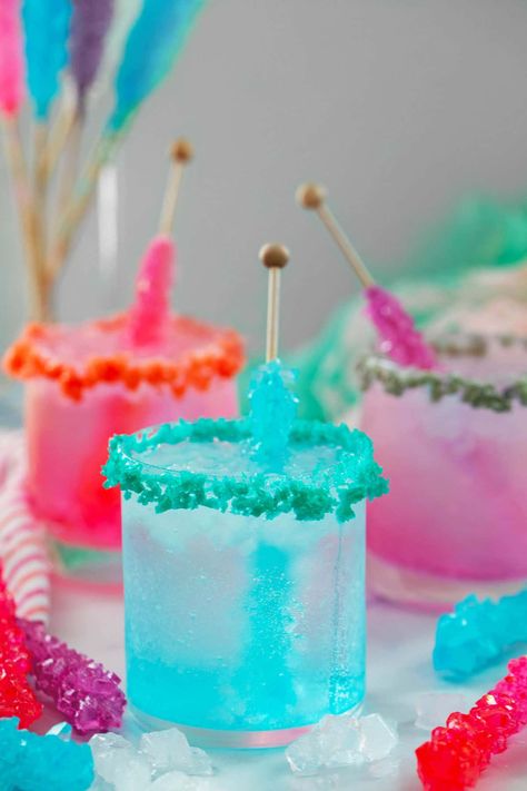 Rock Candy Cocktail -- These Rock Candy Cocktails are incredibly easy to make with just a few ingredients. The pretty drinks are simple vodka sodas with a rock candy stick stirred in for a little sweetness and fun color! Rock Candy Cocktail, Make Rock Candy, Fun Drink Recipe, Candy Stick, Best Summer Cocktails, Candy Cocktails, Colorful Drinks, Candy Drinks, Yummy Alcoholic Drinks