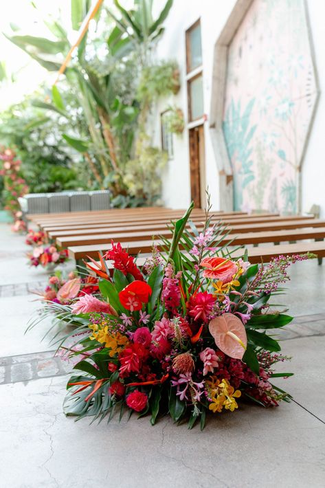 tropical inspired aisle floral arrangement #DTLAwedding #colorfulweddingplanner #tropicalinspiredwedding Tropical Wedding Flowers Ceremony Arch, Island Floral Arrangement, Tropical Wedding Aisle Flowers, Tropical Aisle Flowers, Tropical Color Wedding, Whimsical Tropical Wedding, Modern Tropical Wedding Flowers, Tropical Ceremony Arch, Tropical Glam Wedding Decor