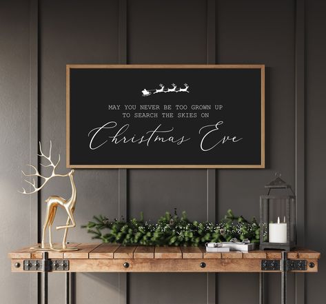 Christmas signs, Wood signs for Christmas, May You Never Be Too Grown Up To Search The Skies on Christmas Eve Size Options:  10"tall, 20"wide 12"tall, 24"wide 14"tall, 26"wide 16"tall, 32"wide 20"tall, 40"wide Background and Text Options: White with black text  Black with white text Gray with white text Red with white text Green with white text Frame options: All frames are made from pine that we personally hand pick and mill.  All frames are colored with stain- White Pine, Natural, Classic Brow Above Tv Christmas Decor, Holiday Boards Signs, May You Never Be Too Grown Up To Search, Large Christmas Signs, Christmas Decor Signs, Funny Christmas Signs, Christmas Wall Decor Ideas, Signs For Christmas, Christmas Wood Signs