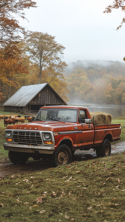 A vintage red Ford pickup truck parked in a field with hay bales in the back. There is a barn and a lake in the background, and the trees are turning red and orange. Fall Pickup Truck, Vintage Truck Wallpaper Iphone, Old Ford Trucks Vintage Wallpaper, Fall Truck Drawing, Vintage Trucks Aesthetic, Old Trucks Aesthetic, Fall Truck Wallpaper, Old Truck Interior Ideas, Old Vibes Aesthetic