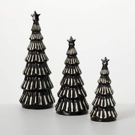 These three small modern black Christmas trees make a welcoming addition to your holiday decor, all without taking up too much space. In graduated sizes, they provide a cozy dose of Yuletide cheer without dominating the room. Perfect for those who enjoy a minimalist Christmas esthetic, their simple black coloring and diminutive size give them an understated elegance that will stand the test of time. Size: 4.75inchL x 4.75inchW x 13.25inchH, 4.5inchL x 4.5inchW x 10.25inchH, 3.25inchL x 3.25inchW x 8inchH. Black White Christmas Decor, Modern Boho Christmas, Black Christmas Decor, Small Tabletop Christmas Tree, Black And White Christmas Decor, Desktop Christmas Tree, Christmas Tree Store, Black Christmas Decorations, Black And White Christmas