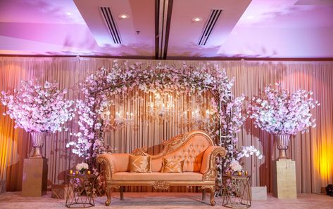 A beautiful cherry blossom arch with shimmering crystal drops and crystal chandeliers - A stage worth a second glance... and a third! 👀  See more of our décor at www.shaadicreations.com! Photography: Joseph Kang Photography #chicagoindianwedding #indianwedding #weddingdress #wedding #bride #groom #bridesmaids #southasianbride #shaadi #indianbride #luxury #love #punjabisuits #punjabiwedding #destinationwedding #weddingphotography #weddingmakeup #weddinginspiration #weddingidea #southasianbride Debut Stage Design, Debut Decorations 18th Diy, Debut Stage Decoration, Shaadi Stage, Stage Backdrop Wedding, Cherry Blossom Arch, Japanese Wedding Theme, Stage Decorations Wedding, Debut Decorations