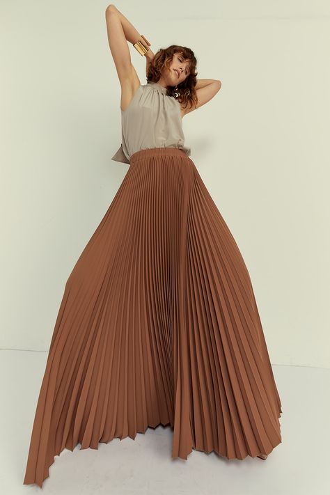 The pleated design adds a touch of texture and movement, creating a flattering A-line silhouette that complements all body types. Whether it features delicate knife pleats for a refined look or bold accordion pleats for added volume, our Pleated Skirt showcases meticulous craftsmanship and attention to detail. 100% Recycled Polyester Fully Pleated Dry Clean Only. This product cannot be washed at home. Please store the product on a clips hanger. Accordion Pleats, Maxi Pleated Skirt, Volume Skirt, Accordian Skirt, Types Of Pleats, Brown Pleated Skirt, Pleats Pattern, Knife Pleats, Hijab Trends