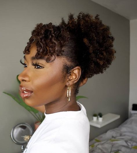 20 Hottest Afro Puff Hairstyles Worth Trying in 2023 Afro Puff With Bangs, Drawstring Afro Puff Hairstyles, Afro Puff Hairstyles Black Women, Natural Puff Hairstyles, High Afro Puff, High Puff Hairstyles, Puff Hairstyle, Puff Hairstyles, Afro Puff Hairstyles