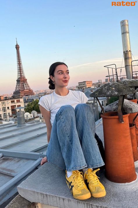 A girl sitting on a rooftop in Paris with the Eiffel Tower in the background wearing Onitsuka Tiger Mexico 66 Yellow Black Trainers Retro Sneakers Aesthetic, Styling Yellow Shoes, Onitsuka Tiger Street Style, Yellow Mexico 66 Outfit, Onitsuka Tiger Women Outfit Yellow, Yellow Tiger Shoes, Cool Trainers Women, Yellow Trainers Outfit, Onitsuka Tiger Shoes Outfit