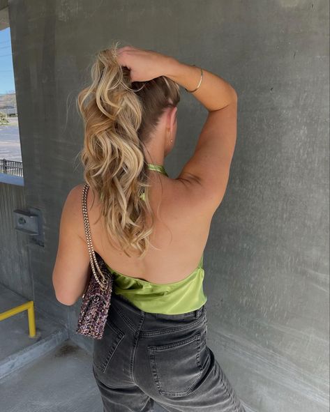 Holding blonde/bronde curled hair up in a parking garage pose with lime green silk halter neck top on and black jeans with a purple handbag and gold jewellery Holding Ponytail Pose, Fixing Hair Pose, Holding Hair Pose, Curled Hair Blonde, Fun Poses, Curled Hair, Pose References, Poses Reference, Human Poses Reference