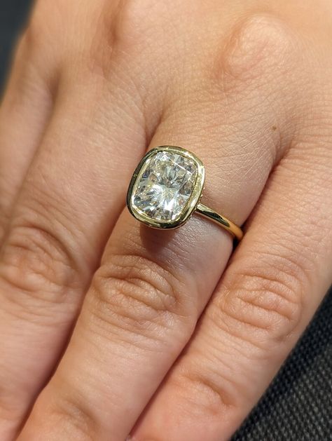 MAIN STONE
Type: Braverman Moissanite
Cut: Cushion
Color: D
Clarity: VVS

#Bezel #Set #3ct #Cushion #cut #Moissanite #Solitaire #Promise #Ring #14K #Yellow #Gold #Hidden #Diamond #Halo #Statement #Ring #Custom #Engagement #Ring #bezel #set #ring #hidden #halo #ring #moissanite #solitaire #moissanite #ring #cushion #moissanite #diamond #hidden #halo #engagement #ring #promise #ring #statement #ring #3ct #moissanite #ring #custom #ring #for #her #wedding #ring #anniversary #ring Elongated Cushion Bezel Engagement Ring, Elongated Cushion Bezel, Ring Images, Engagement Ring Types, Anniversary Rings For Her, Wedding Anniversary Ring, Ring Inspo, Bezel Engagement Ring, Future Engagement Rings