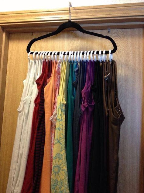 Great space saver!!! Use shower curtain rings and put them on a hanger to use as a way to hang all of your tank tops on one hanger. Would work for scarves, too! Dorm Closet Organization, Dorm Room Closet, Dorm Closet, Eclectic Glam, Closet Room Organizer, Scandinavian Eclectic, Diy Rangement, Closet Organization Ideas, Clothes Closet Organization