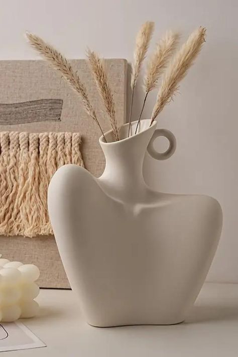 Embrace the beauty of simplicity with our Minimalist Human Body Vase. Inspired by the elegance of the human form, this unique piece adds a touch of artistry to your space. ✨ Pottery Unique Ideas, Feminine Pottery, Ceramic Vase Decor, Vase Mural, Torso Vase, Pottery Aesthetic, Vase Aesthetic, Body Vase, Ceramic Vases Design