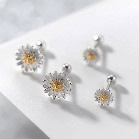 Introducing our charming Sterling Silver Daisy Stud Earrings, a delightful accessory that captures the essence of timeless elegance and natural beauty. Perfect for adding a touch of floral charm to any outfit, these earrings are available in two sizes, offering versatility and choice to suit your personal style. Crafted from high-quality sterling silver, each earring features a meticulously detailed daisy design, showcasing the fine craftsmanship and attention to detail. They make an ideal gift Daisy Studs, Flower Daisy, Daisy Design, Kids Birthday Gifts, Stud Earrings For Women, Flower Earrings Studs, Flower Studs, Small Flowers, Jewelry Earrings Studs