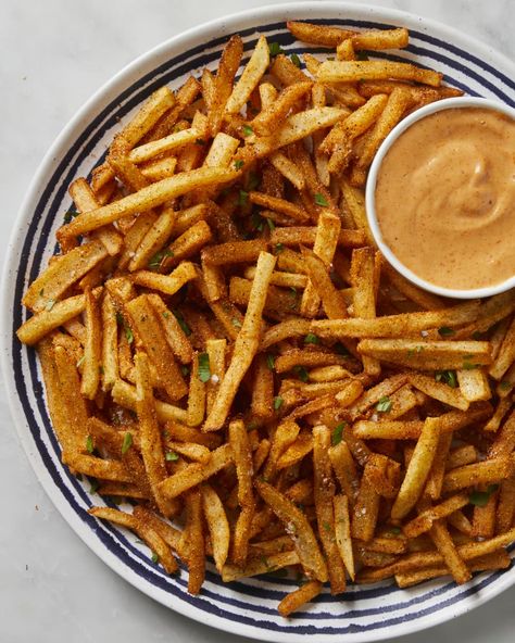 Overhead shot of fries on a blue and white striped plate with a side of remoulade in a small bowl on the plate. Cajun Fries Recipe, Cajun Seasoning Recipe, French Fries At Home, Fries At Home, Cajun Fries, Homemade Cajun Seasoning, Making Fried Chicken, Crispy French Fries, Seasoning Recipe