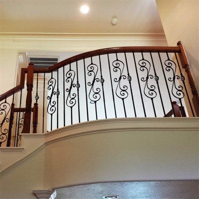 (Pack of 5) True satin black, non-flat matte. Swirled wrought iron railings are perfect for creating a stunning focal point in the center of balconies and rakes that are sure to wow your guests. | BTERAZ Iron Railings Metal | 0.5 W in | Wayfair B07SNRNZ2F Glass And Metal Stair Railing, Wrought Iron Stair Railing Farmhouse, Stair Railings Farmhouse, Elegant Stairs, Wrought Iron Stair Spindles, Porch Step Railing, Iron Stair Spindles, Iron Railings Outdoor, Iron Staircase Railing