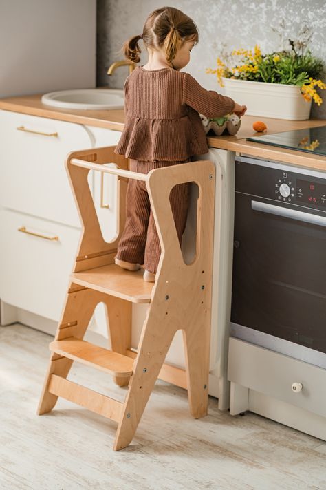 It allows kids to participate in cooking, baking, and other kitchen activities alongside adults. It's an excellent way for children to build confidence and foster a sense of independence in the kitchen and in other daily processes. That toddler tower can be used to help children reach higher places to wash their hands, brush their teeth, or access other areas where adult assistance is required. Toddler Tower, Kitchen Activities, Kitchen Tower, Toddler Step Stool, Kitchen Step Stool, Childrens Kitchens, Kitchen Help, Montessori Furniture, Learning Tower