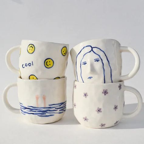 Sisaret's Ceramic Grumpy Gal Mug is what I look like before I have my morning tea. Holds 12-14 Ounces Dishwasher and Microwave Safe Each ceramic piece is pinched and painted by hand, so no two pieces are ever the same Handmade in Revelstoke, British Columbia When you shop at Victoire, you're supporting independent artists like Sisaret, a line of small-batch jewelry and ceramics founded by two sisters with Finnish roots. Cup Ceramic Handmade, Cute Ceramic Mugs Ideas, Painting Pottery Mug Ideas, Funny Ceramics Ideas, Cute Mug Pottery, Handbuild Mugs, Christian Cups, Small Pottery Ideas, Cup Painting