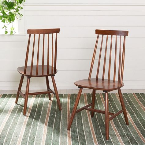 Give your dcor a touch of farmhouse finery with this Priam Dining Chair. Beautifully styled with a classic spindle back, Priams warm walnut finish perfectly accents any rooms color scheme. Sold in sets of two. Walnut Dining Chair, Spindle Dining Chair, Rattan Dining Chairs, Room Color Schemes, Living Room Accents, Farmhouse Style Kitchen, Walnut Finish, Room Colors, Contemporary Decor