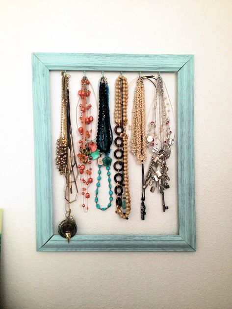 I would like you to tell the story of this exceptional DIY jewelry holder project that helped a lot in the easy and classy organization of my necklaces. I used to hang the necklaces on the wall nails, it worked for me with no issue, but soon I realized that I have to spice my jewelry storage game. So, I came with this DIY necklace holder idea, it is super inexpensive, and it made me feel proud, too, when I put my old frame to new creative use. You may also be having some old picture frames at Diy Necklace Holder Stand, Diy Jewelry Holder Frame, Necklace Organizer Diy, Diy Necklace Holder, Diy Necklace Display, Frame Necklace, Jewelry Storage Diy, Homemade Necklaces, Diy Jewelry Holder