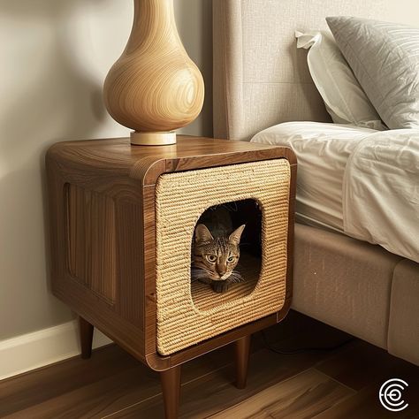 The Cat Scratching Post Bedside Table combines functionality and style. Featuring a built-in scratching post inside the table, it offers a discreet and durable solution for your cat’s scratching needs. The tabletop is perfect for holding a lamp, books, or other essentials, seamlessly fitting into any bedroom decor while keeping your cat entertained and your furniture protected. Conceptual AI Art Follow @ecosapiens for more! Night Stand Cat Bed, Coffee Table Cat Bed, Cat End Table, Cat Bed Nightstand, Cat Interior Design, Stylish Cat Furniture, Cat Living Room, Cat Decor Bedroom, Cat House Ideas