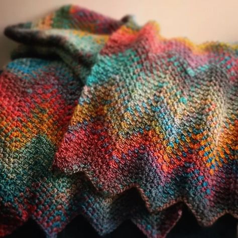 Yarnspirations | The Vibrancy! The moss stitch in this ripple throw showcases the rich jewel tones and swirling colors of the Paparazzi shade of Roll With… | Instagram Crochet Moss Stitch Ripple Blanket, Ripple Moss Stitch Crochet, Roll With It Melange Yarn Patterns, Moss Stitch Ripple Crochet, Moss Stitch Crochet Blanket, Ripple Crochet, Knitting Quilt, Rich Jewel Tones, Crochet Ripple Blanket