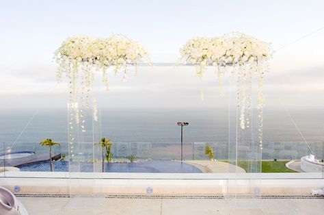 Acrylic Chuppah with White flowers - Rent yours today. 305 807 8014 Acrylic Arch, White Wedding Ceremony, Beach Wedding White, Beach Wedding Decorations Reception, Wedding Arches, California Wedding Photography, Wedding Ceremony Backdrop, Wedding Beach Ceremony, Wedding Colors Blue