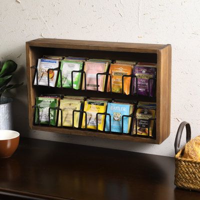 The chic dark burnt wood finish brings a touch of rustic charm to any setting and can complement vintage or country-inspired decor. This 10 baskets tea bag organizer rack is a useful addition to any setting where hot beverages are served. | MyGift 10 Compartment Wood Tea Box Organizer Wood in Brown | 10 H x 15.6 W x 3.5 D in | Wayfair Tea Bar Organizer, Diy Tea Box Storage Ideas, Tea Organizer Ideas, Tea Holder Organizers, Tea Storage Organizing, Diy Tea Bag Organizer, Tea Organization Ideas, Tea Bar Station, Tea Storage Ideas