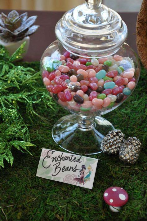 Fairy---Enchanted  Beans (Jelly Belly jelly beans in a glass jar. Simple and cute idea----Image Only Party Favors Fairy Theme, Fairy Themed Birthday Party Ideas, Fairycore Party Ideas, Fairy Party Food Table, Fairy Dessert Table Ideas, First Garden Party 1st Birthdays, Fairy Garden Party Decorations Diy, Outdoor Fairy Birthday Party, Woodland Fairy Party Decorations