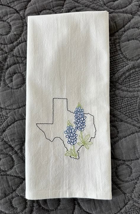 "Decorate your kitchen with these machine embroidered  State  flower kitchen towels, or given as a gift.  Each towel will be stitched  with your choice of 1 State   design, as shown in photo of Texas Bluebonnet.    Please Note  the photos which have multiple State designs is for visualization of the designs for the State,  not a representation of what this item is. If you want a close up photo of your State choice please message me.   The  towel color is Natural as in photo of Texas , but if stated can do white as well.  Machine embroidered with high quality thread on 100% cotton flour sack towels 18\"x28\", wash and tumble dry light iron if needed." Machine Embroidered Tea Towels, Dish Towel Embroidery Patterns Free, Hand Embroidered Tea Towels, Bluebonnet Embroidery, Tea Towel Crafts, Embroidery Tea Towels, Kitchen Towel Embroidery, Dish Towel Embroidery, Embroidery Kitchen Towels