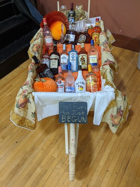 Wheelbarrow Of Booze Raffle, Barrel Of Booze Raffle Ideas, Raffle Basket Ideas, Auction Gift Basket Ideas, Raffle Ideas, Wooden Wheelbarrow, Raffle Basket, Raffle Baskets, Staff Room