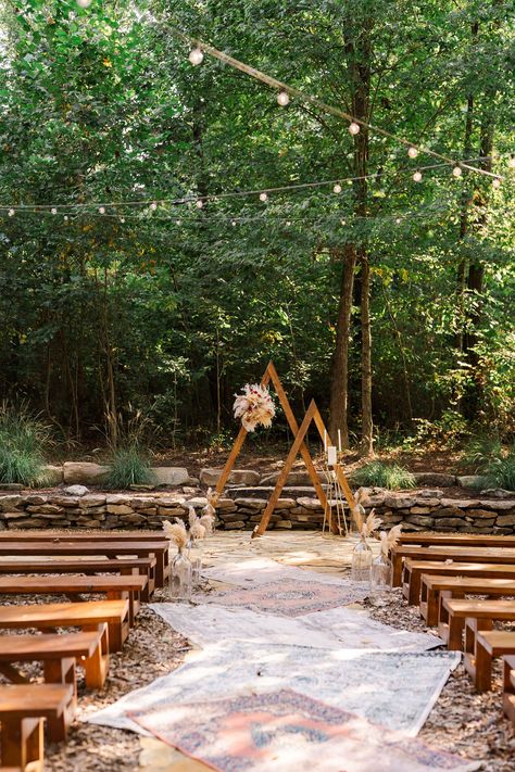 Outdoor wedding ceremony with vintage rug runner, triangular arches with textured floral arrangements. Unique aisle decor. Ceremony flowers. Vendors: Venue: @thebarnatwhiteoaks Planning/Coordination and Rentals/Decor: @caricoevents DJ: @pervineproductions Catering: @wishingwellbbq Rugs Wedding Ceremony, Carpet Aisle Runner Wedding, Rug Isle Runners Wedding, Rug Aisle Wedding, Rug Wedding Aisle, Isle Runners, Wedding Ideas 2024, Boho Wedding Ceremony, Outdoor Wedding Ideas