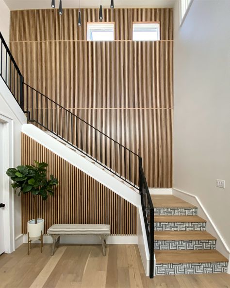 Slat Accent Wall Slat Paneling Staircase Paneling Modern paneling The slat wall is made of white oak slats that were attached to a backer board. The backer board was applied to the wall first. The backer board has straight lines routed out and was painted Sherwin Williams Tricorn black. The white oak slats were then nailed into the routed out grooves to ensure that they were all straight. The white oak was sealed with a clear coat and left to be its natural color Modern Paneling Design Ideas Woo Backlit Slat Wall, Slat Wall Staircase, Staircase Redesign, Paneling Staircase, Modern Paneling, Sherwin Williams Tricorn Black, Slat Accent Wall, Nevada House, Staircase Paneling