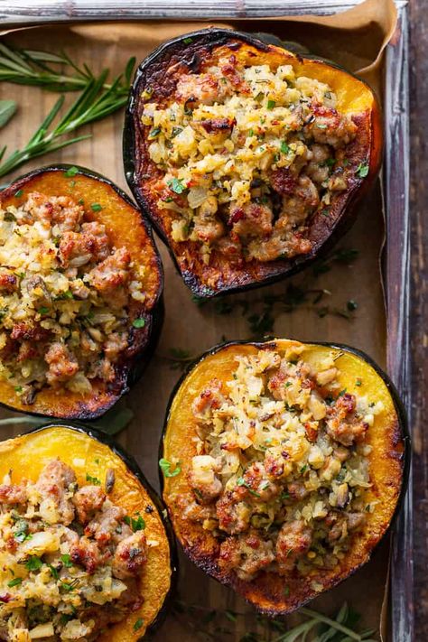 This savory stuffed acorn squash is so delicious it’s addicting!  A sausage and cauliflower rice stuffing is seasoned with lots of fresh herbs and served toasty in roasted acorn squash bowls.  Perfect as a holiday side dish or an anytime meal.  Paleo, Whole30, and low in carbs. Acorn Squash With Sausage, Squash With Sausage, Sausage Stuffed Acorn Squash, Zucchini Zoodles, Paleo Running Momma, Sausage Rice, Rice Stuffing, Stuffed Acorn Squash, Butternut Squash Salad