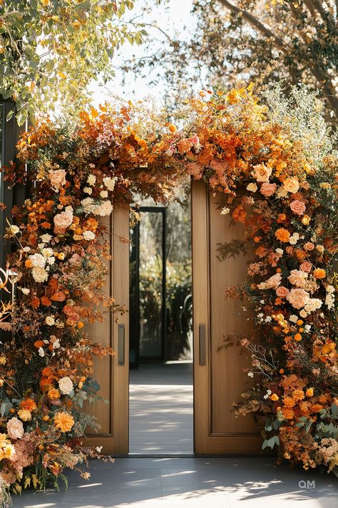 Outdoor fall wedding setup with doors adorned in vibrant autumn floral arrangements, showcasing autumn elegance and rustic wedding aisle decorations. Terracotta Wedding Ideas, Earth Tones Wedding Colors, Terracotta Flowers Wedding, Warm Earth Tone Wedding, Terracotta Reception, Terracotta And Burgundy Wedding, Earth Tones Wedding, Terracotta Flowers, Earth Tone Wedding