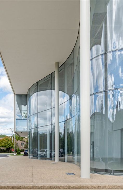 glass facade of a new theater building in Wilmette, IL Curtain Glass Wall Facade, Curved Glass Architecture, Curved Steel Structure, Curved Facade Design, Curved Glass Facade, Glass Facade Architecture Design, Curved Building Facade, Curved Building Architecture, Curved Facade Architecture