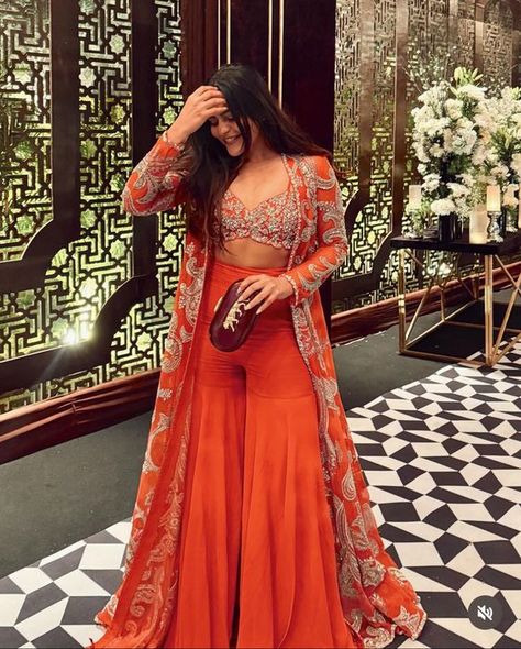 Haldi Trending Outfits, Poses In Indo Western Dress, Western Indian Outfits Women, Crop Tops For Lehenga Indian Weddings, Western Wedding Ideas Dresses, Orange Indian Lehenga, Women Haldi Outfit, Ethnic Indo Western Outfits, Destination Wedding Indian Outfits