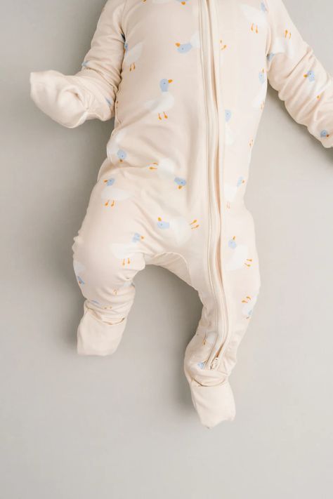 Buttery soft, lightweight, breathable, and stretchy Fold over mittens up to 12-18M Fold over footies Features a 2-way zipper for easier changes Designed with a snug fit for safety Fabric: 95% viscose bamboo, 5% spandex No flame retardants or chemicals Machine wash, tumble dry