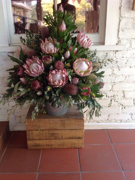 Feature Arrangement of King Protea Banksia and Pink Ice King Protea Arrangement, Protea Arrangements Modern, Winter Floral Arrangements For Church, Protea Floral Arrangements, Protea Flower Arrangements, Flower Arrangements For Church, Tall Flower Arrangements, Modern Floral Arrangements, Altar Flowers