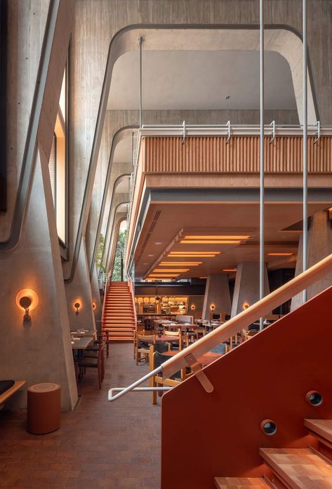 The triple-height atrium of the Ace Hotel Toronto conveys a feeling of layers upon layers. Below the suspended mezzanine is Alder restaurant. Ace Hotel Toronto, Toronto Architecture, Hotel Exterior, Restaurant Seating, Hotel Entrance, Hotel Branding, Ace Hotel, Brick Facade, Hospitality Design